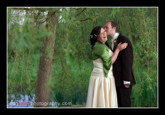 Anna and Ross kissing under a willow, wedding portrait by Mat Smith Photography, Hardwick House Hotel, Gloucestershire