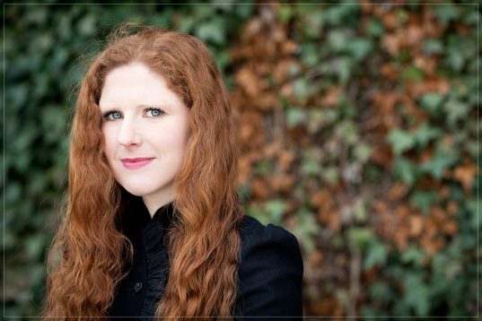 Cheryl Frances-Hoad, composer, portrait against ivy by Mat Smith Photography, Cambridge