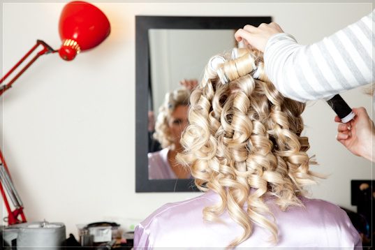 Nikki with a mirror and Anglepoise lamp in the bridal suite, Hurley