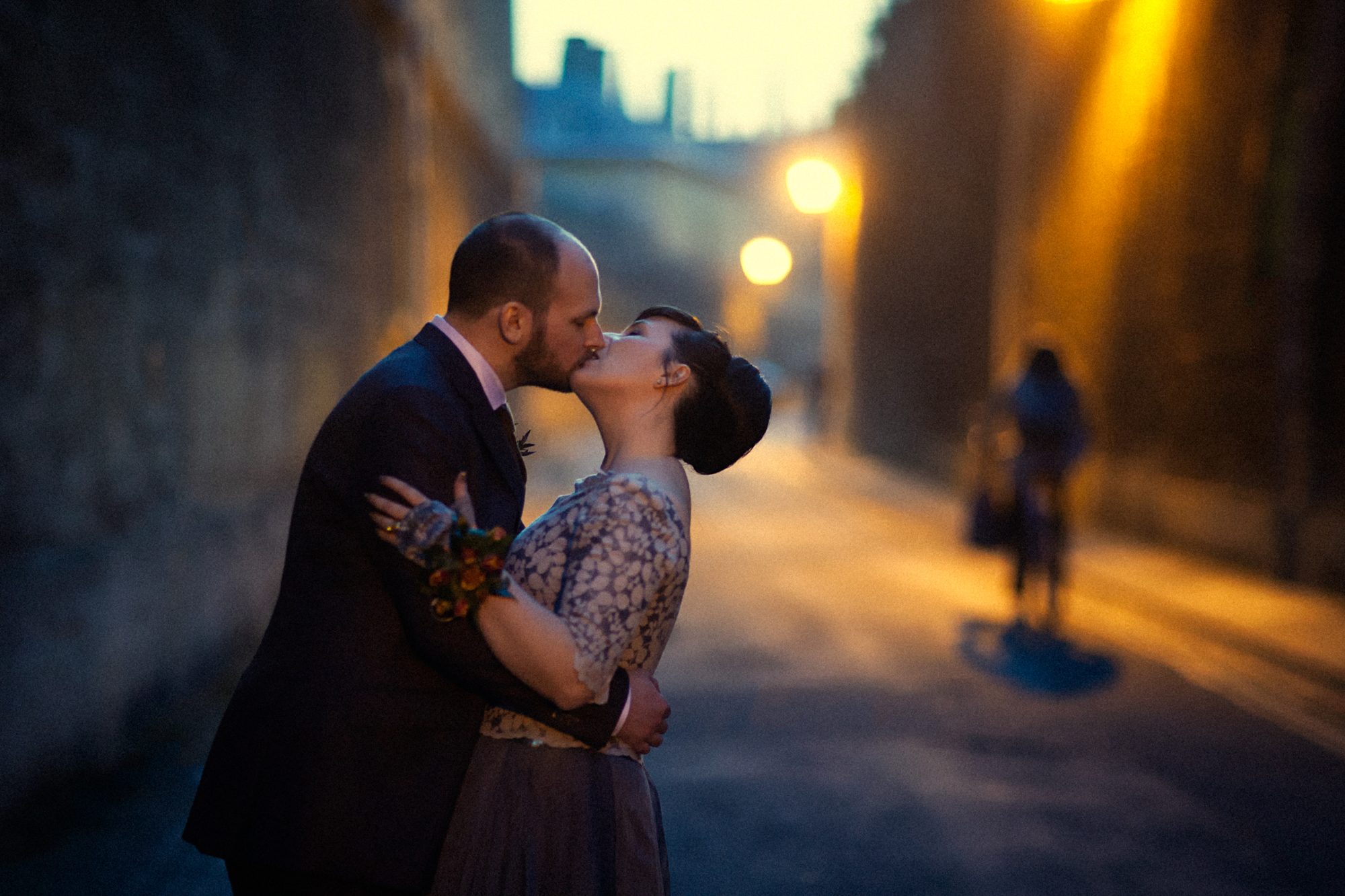 Nat and Ivan, bride and groom, kissing in the street at dusk, wedding portrait by Mat Smith Photography, Oxford