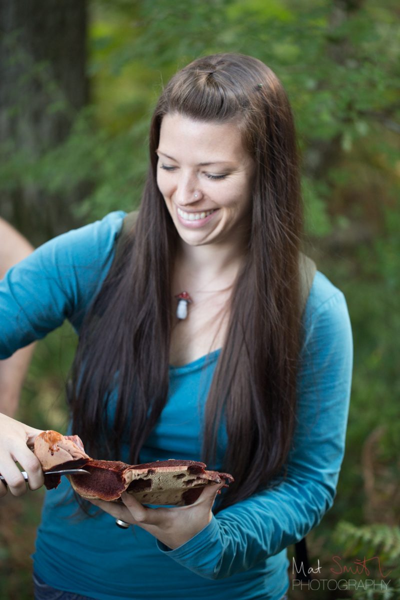 Lisa Cutcliffe cutting a beefsteak bracket mushroom, New Forest