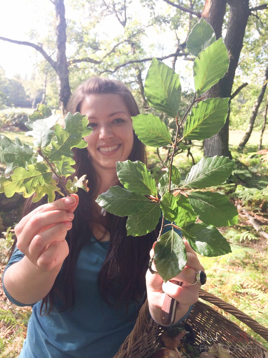 Lisa Cutcliffe holding oak and beech leaves, New Forest
