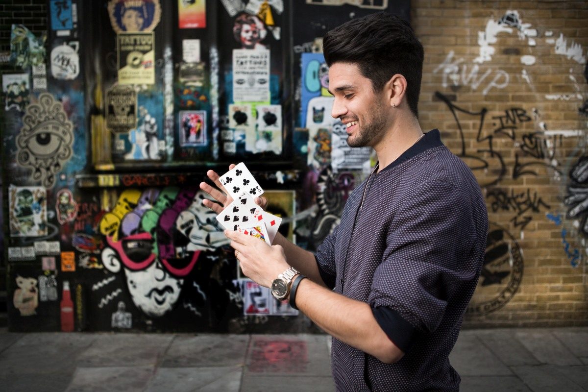 Maddox Magic, magician, with playing cards, portrait by Mat Smith Photography, Brick Lane