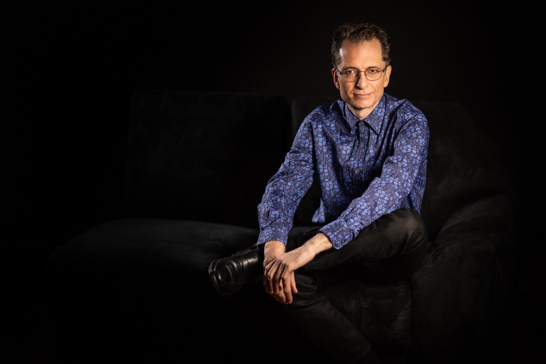 Gavin greenaway pianist conductor portrait on sofa