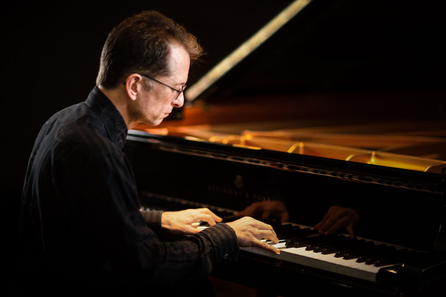 Gavin Greenaway, composer and pianist, at the Steinway, portrait by Mat Smith Photography, Air Studios, Hampstead