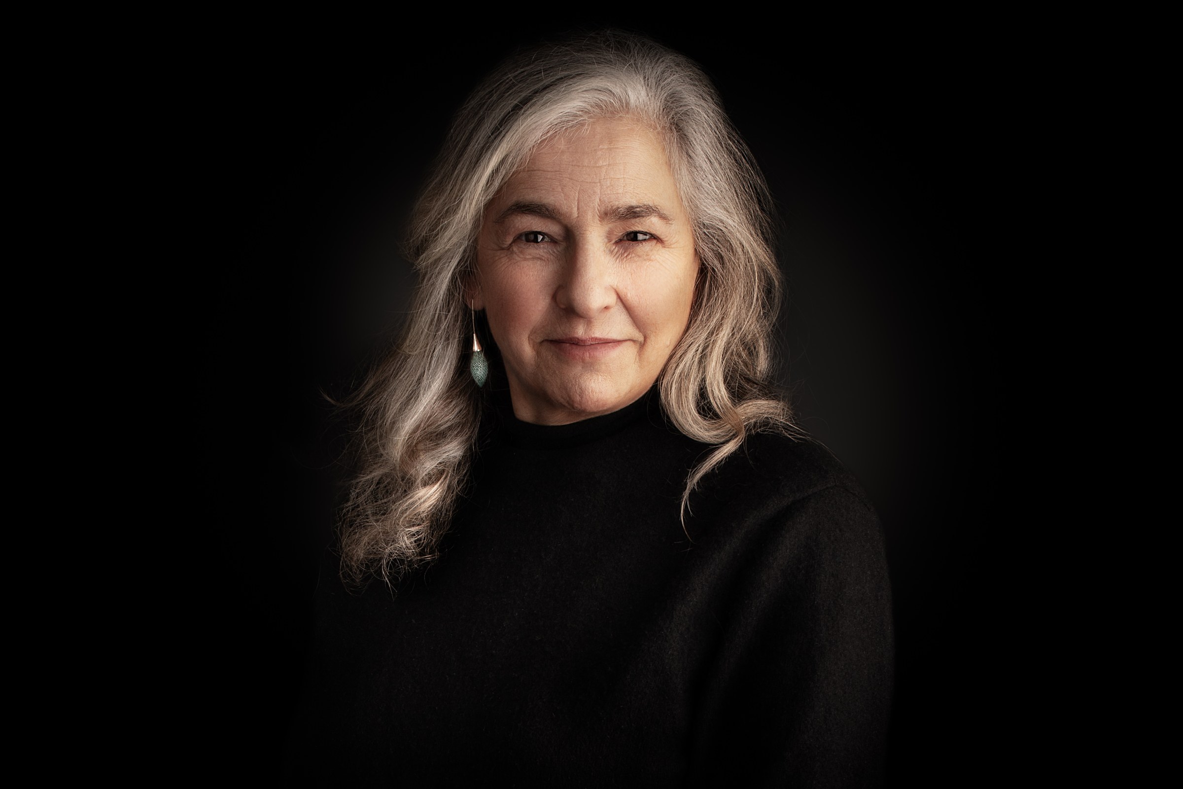 Karen Liebreich MBE, author and historian, head and shoulders against a black background, portrait by Mat Smith Photography, Chiswick