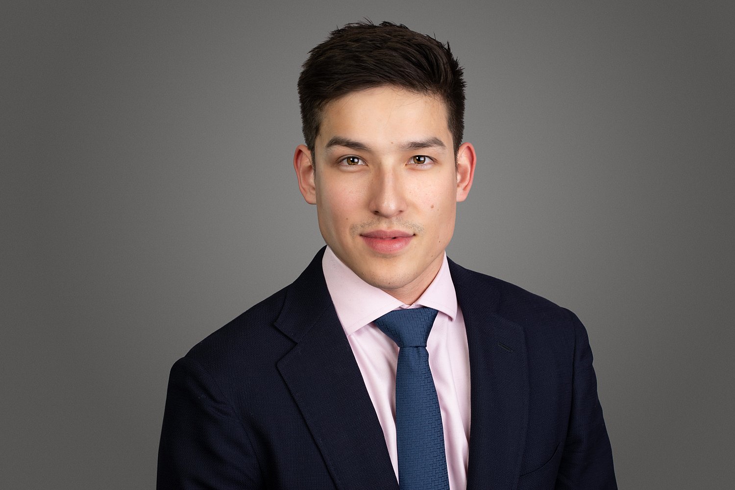 Sharp-suited consultant, a modern corporate headshot