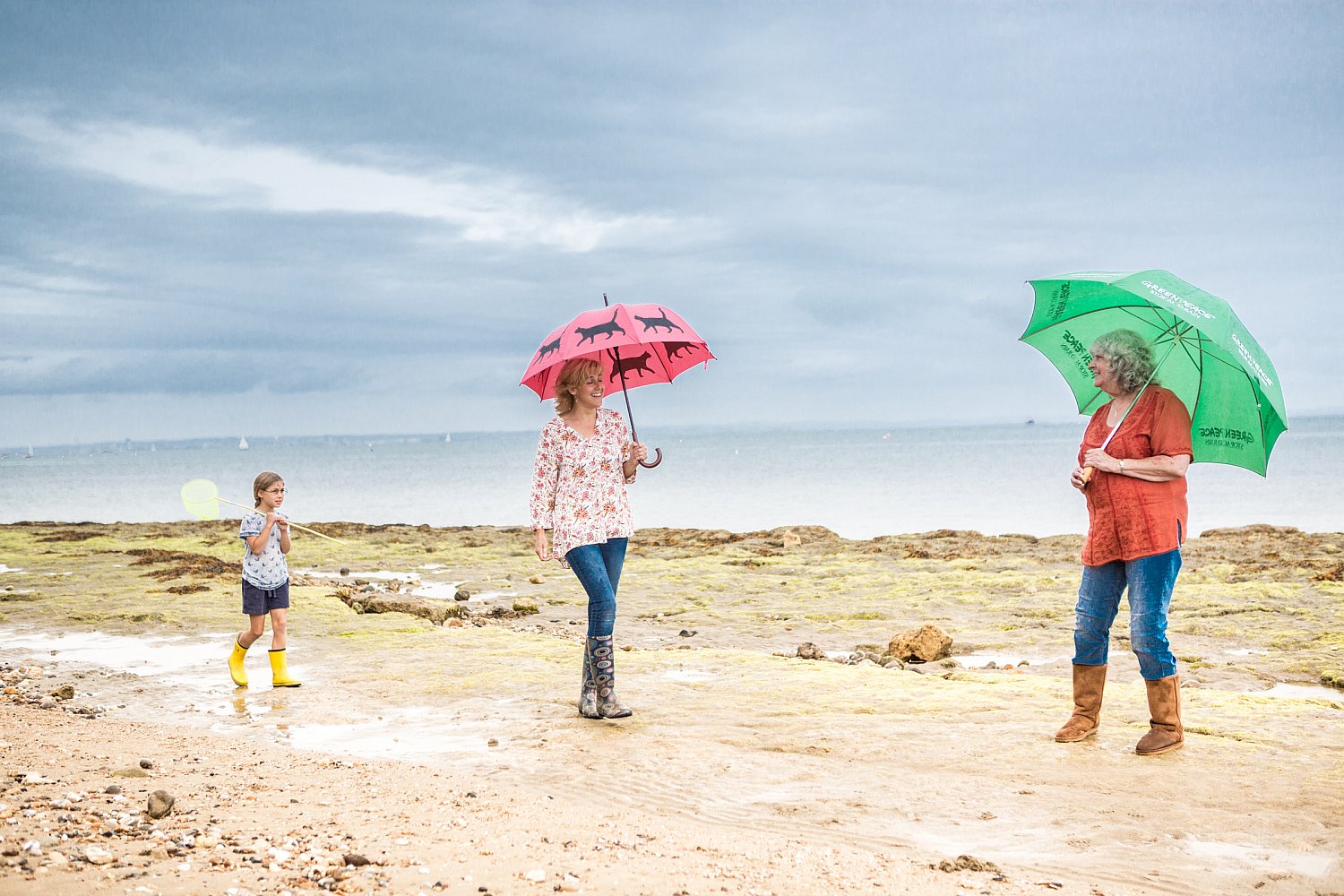 English summer beach with umbrellas under a bright sky, Isle of Wight