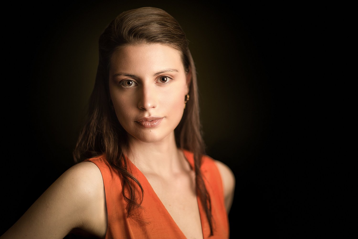 Children's author in an orange dress, atmospheric portrait